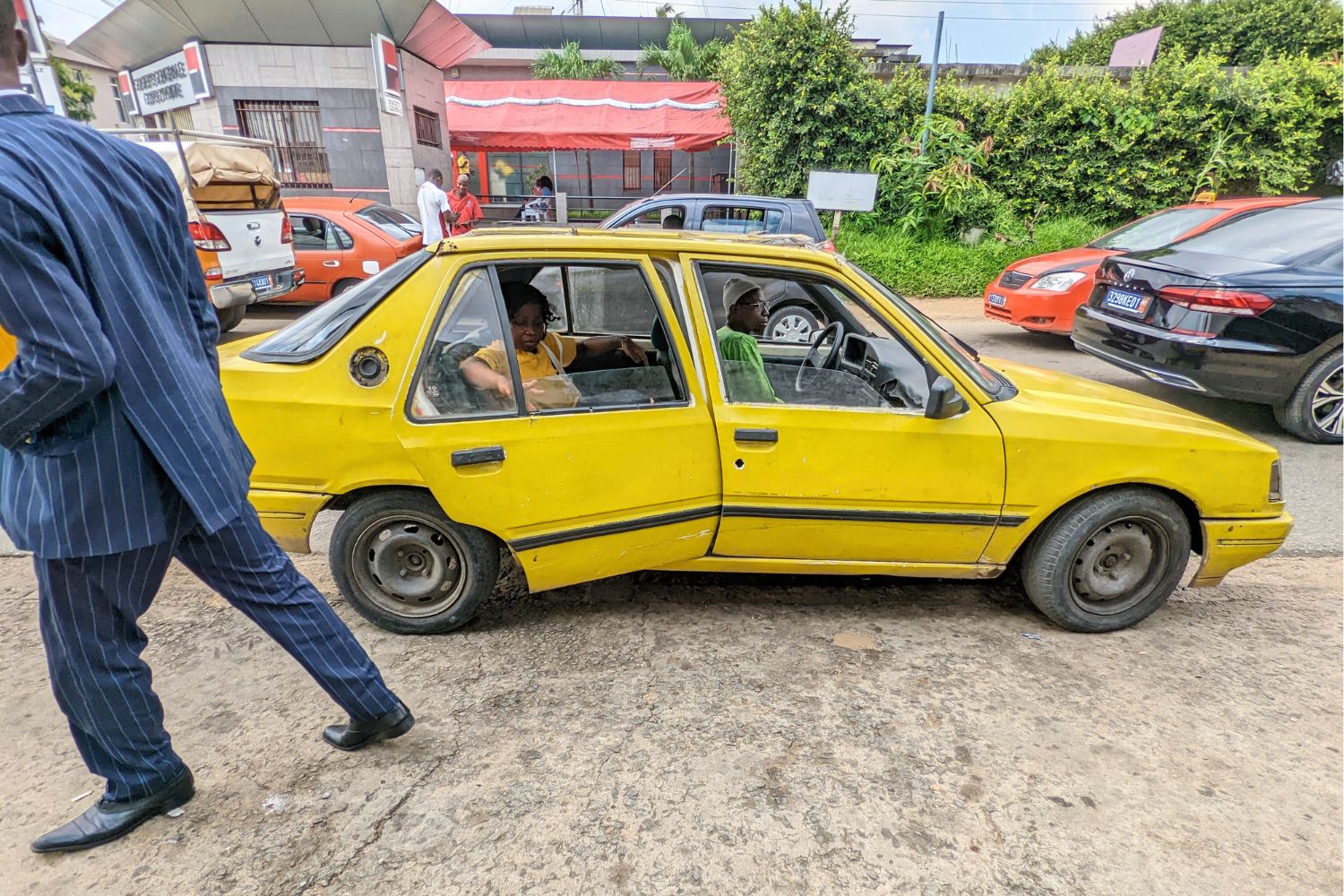 Yellow taxi with a passenger getting in or out